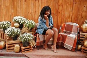 Stylish trendy afro france curly woman posed at autumn day in jeans jacket. Black african female model. photo