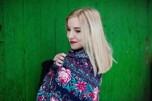 Blonde girl with hand embroidered scarf posed at winter day. Women's handkerchief. photo