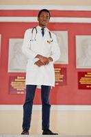 Stylish african american doctor with stethoscope posed indoor. photo