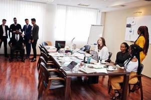 Diverse business people on a meeting at round table. photo