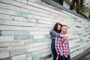 Stylish couple wear on checkered shirt in love together. photo