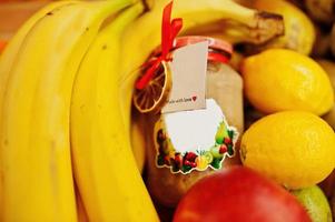 Hommemade jar with bananas on the shelf of a supermarket or grocery store. Made with love. photo