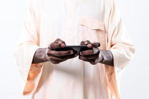 african man using smartphone photo