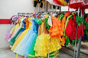 Children's carnival costumes at seamstress office. photo