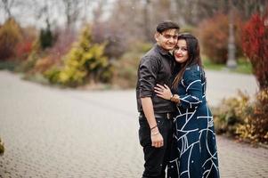 Love story of indian couple posed outdoor. photo