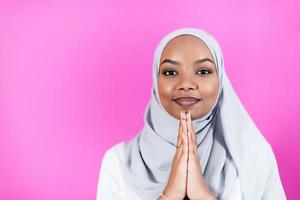 African Muslim woman makes traditional prayer to God photo