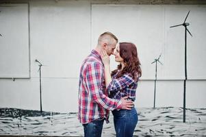 Stylish couple wear on checkered shirt in love together. photo