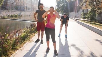 group of young people jogging in the city photo