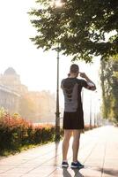 man jogging at sunny morning photo