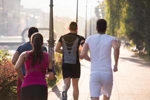 group of young people jogging in the city photo