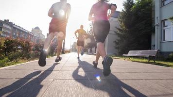 group of young people jogging in the city photo