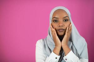 African Muslim woman makes traditional prayer to God photo