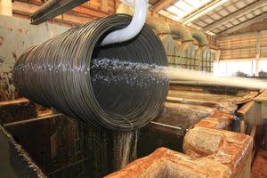 Large spools of Steel Coils being moved. photo