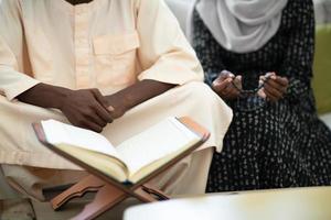 african couple at home reading quaran photo