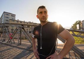 portrait of a jogging man at sunny morning photo