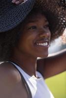 Close up portrait of a beautiful young african american woman smiling and looking up photo