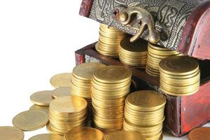 A wooden ancient chest full of money photo