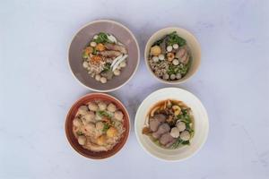 Overview of 4 bowls of noodles photo