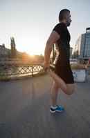 athlete man warming up and stretching photo