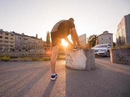 man tying running shoes laces photo