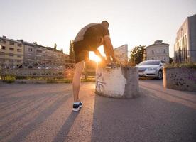 man tying running shoes laces photo