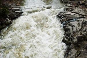 Incredible and stormy Prut river at Carpathian mountains, Jaremcze resort, Ukraine, Europe. photo