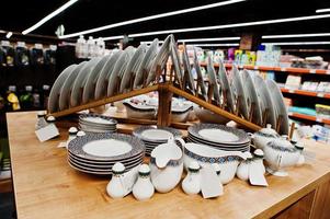 Set of dishes on supermarket shelves for sale. photo