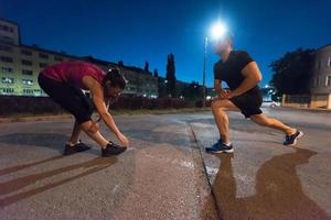 couple warming up and stretching photo