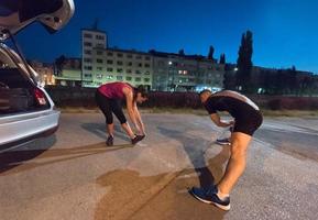 couple warming up and stretching photo