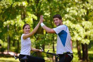 Happy couple ridine bicycle outdoors photo