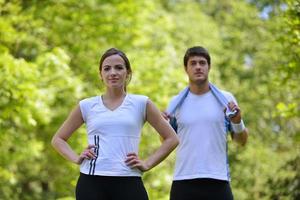 Couple doing stretching exercise  after jogging photo