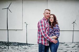 Stylish couple wear on checkered shirt in love together. photo