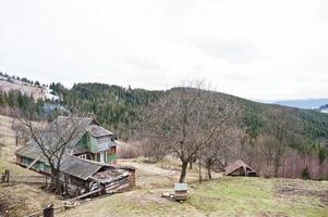 Old wooden vintage and rusty house at Carpathian mountains. photo