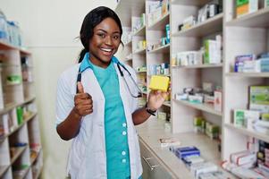 African american pharmacist working in drugstore at hospital pharmacy. African healthcare. photo