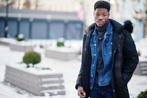 African man wear on jacket at cold winter weather posed outdoor. photo