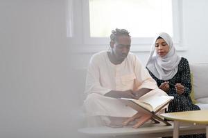 african couple at home reading quaran photo