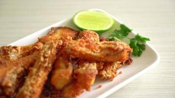 Fried Snapper Belly on white plate - Asian food style video