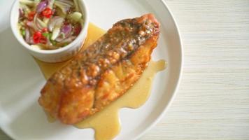 fried snapper fish with fish sauce and spicy salad - Asian food style video