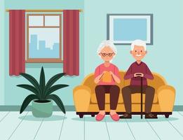 elderly couple seated in sofa