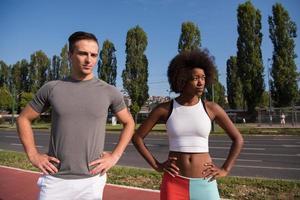Portrait of romantic pretty couple on fitness session, outside town background photo
