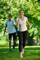 Young couple jogging at morning photo