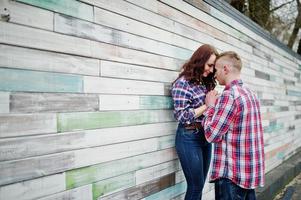 Stylish couple wear on checkered shirt in love together. photo