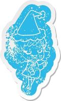 happy cartoon distressed sticker of a elf girl pointing wearing santa hat vector