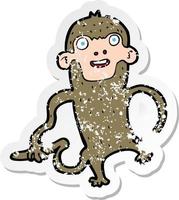 retro distressed sticker of a cartoon monkey vector