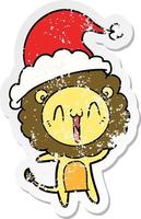 happy distressed sticker cartoon of a lion wearing santa hat vector