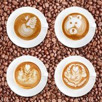 Latte art coffee on roasted coffee beans background photo