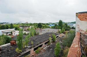 Industria exterior of an roof old abandoned factory. photo