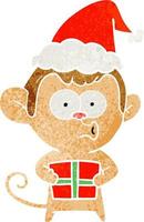 caricatura retro de un mono navideño con sombrero de santa vector