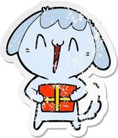 distressed sticker of a cute cartoon dog with christmas present vector