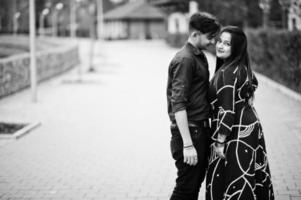 Love story of indian couple posed outdoor. photo